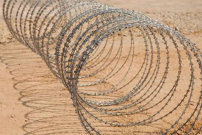 Concertina barrier at the edge of a secured area
